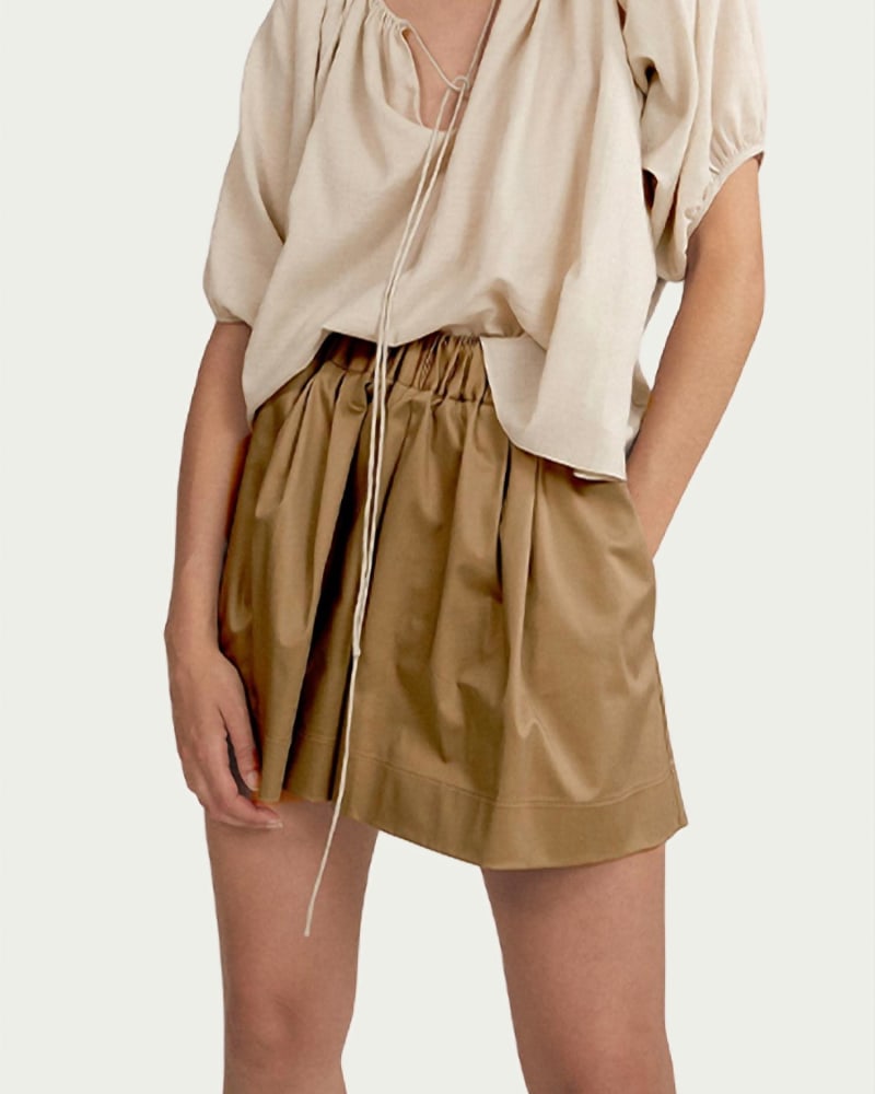 Front of a model wearing a size L Eulalie Silk-Cotton Crepe Blouse in Pumice in Pumice by WORN. | dia_product_style_image_id:345889